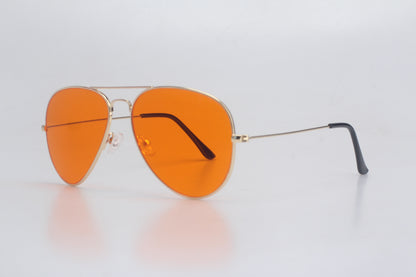 Aviator Blue Light blocking glasses with orange lenses on a light gray background