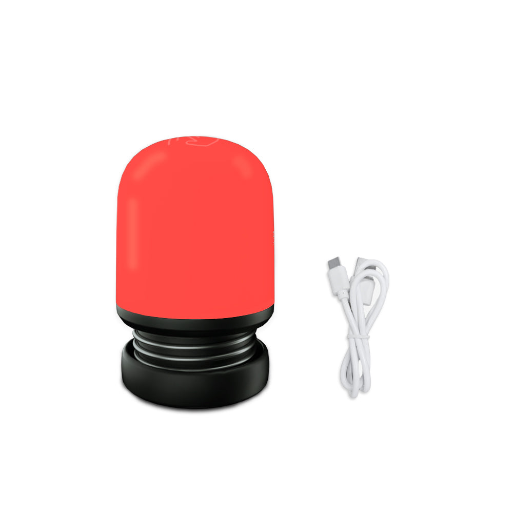 Red light bulb with black base and white cable on a white background